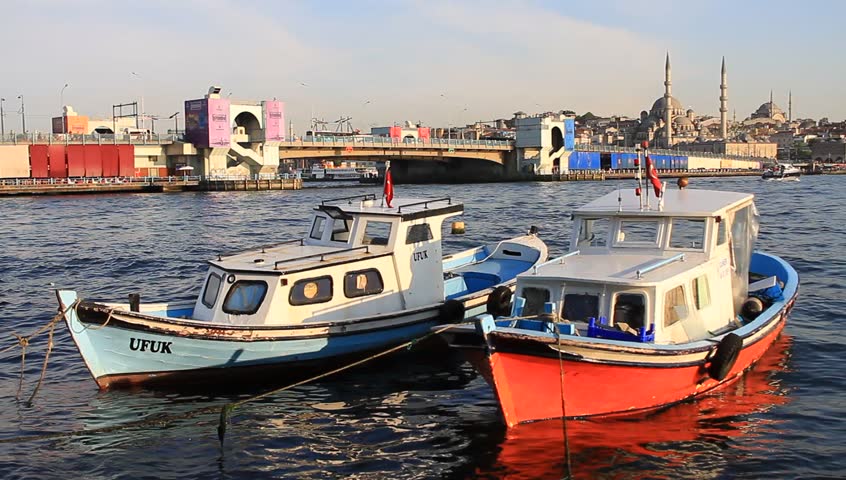 ISTANBUL - JUNE 4:  Lined up fisher boats in Goldenhorn looking to Bridge on