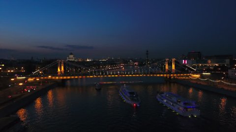 night illuminated moscow river ship traffic krymsky bridge aerial panorama 4k russia