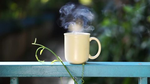 Positive thinking concept: having fun while enjoying a hot cup of coffee outdoors