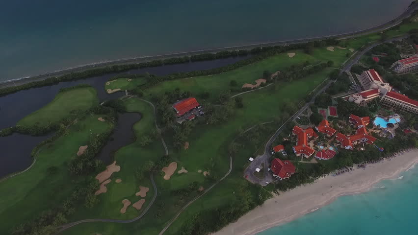 Drone flying over Varadero, Cuba. Aerial view of Cuban tropical beaches. Landscape seen from the sky with clouds and ocean. Travel destination for tourism, holidays and vacations