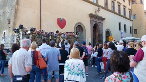 Nemi, Italy - June 2017: People attending music orchestra military performance at festival of strawberry