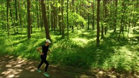 Beautiful sporty girl  jogging in the forest
