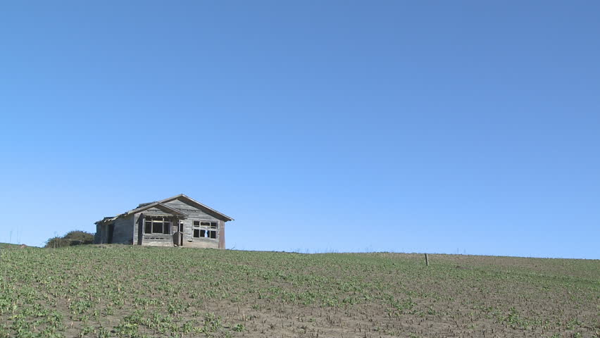 Old and abandoned farm house on a hill