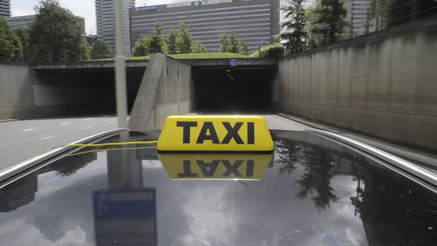 Taxicab driving through a tunnel Royalty-Free Stock Footage #2747981