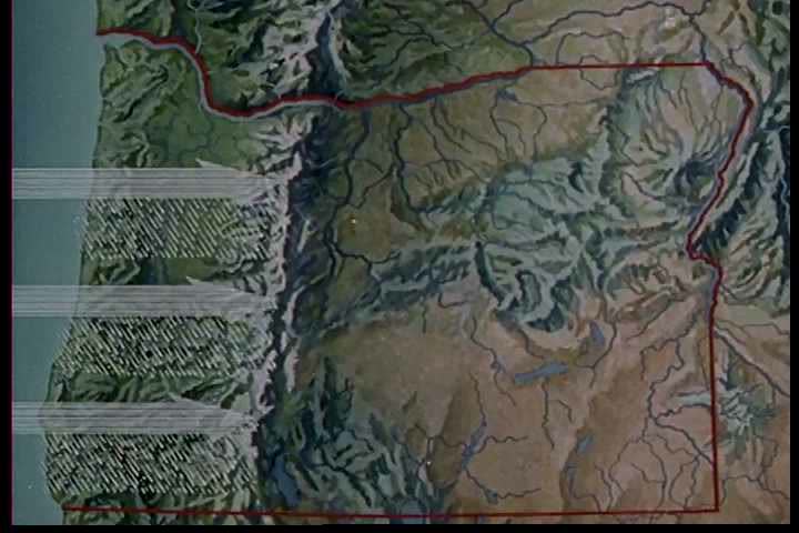 1970s: Diverse mountain ranges are shown in Oregon in 1970: some are snow-capped; cows graze before others.