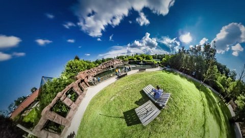 360Vr Video 360 Degrees, Timelapse. Family Vacations in Warm Summer. Recreation at the Nature, Green Fresh Lawns. Father and Little Kid on a Chaise Longue Are Looking Around at Visitors of the Zoo.