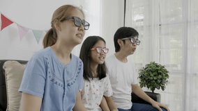 4K : Adorable family watching a 3D movie together with 3D glasses