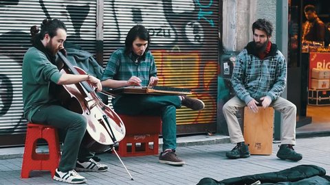 ISTANBUL, TURKEY, JUNE 5, 2017: Street musicians performing at one of the corners of Beyoglu Avenue, one of the most famous avenues in Istanbul, visited by nearly 3 million people in a day.
