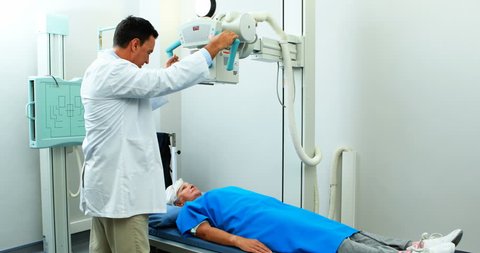 Senior woman undergoing an x-ray test in hospital