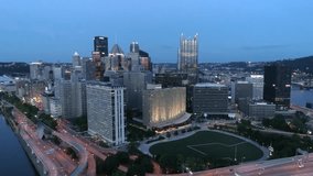 Pittsburgh Aerial 4K Flying Through Skyscrapers Downtown at Dusk Viewing Beautiful Illuminated City Skyline
