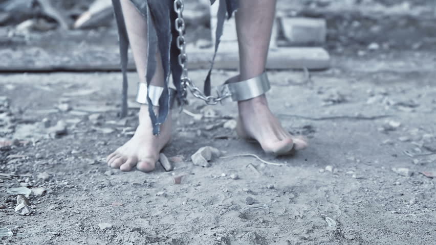 the legs of the prisoner in chains closeup Royalty-Free Stock Footage #27538039