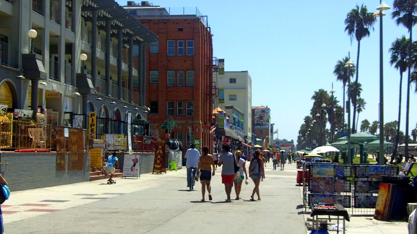 A shot looking down the Venice Beach Boardwalk with souvenir shops, historic