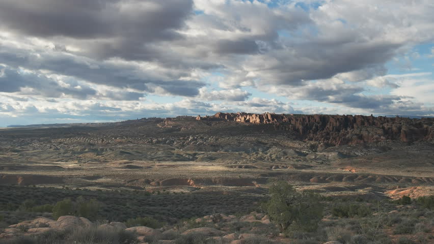 late afternoon pan of rock formations at arches national park in utah, usa