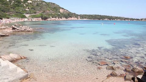 Travel destinations in Sardinia, Italy, with beach, sea and natural landscape at Cala Spalmatore, La Maddalena island, Sardegna, Italia. Sequence with native sound