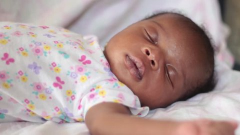 2 Week Old Black Baby Sleeping Peacefully CloseUp Sideview