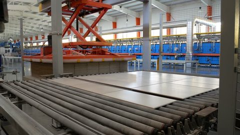Modern Factory for the Production of Ceramic Tiles. The Process of Making Ceramic Tiles. 
Conveyer Line For Ceramic Tile At Heavy Plant