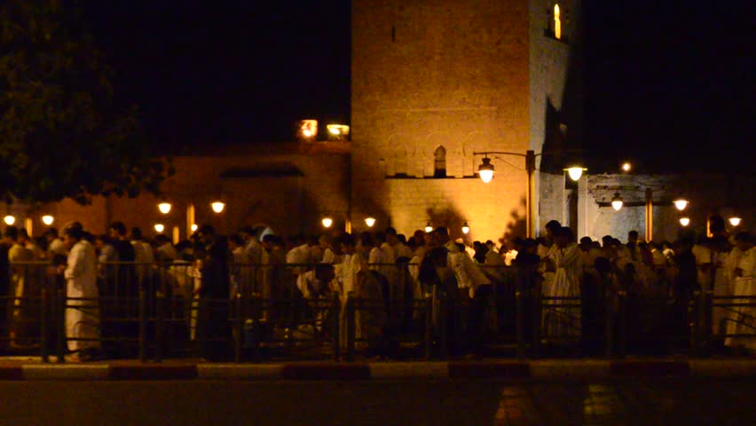 MARRAKECH, MOROCCO - CIRCA 2012: pray at night in front of Koutoubia mosque