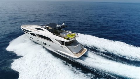 SANREMO – MAY 12: Aerial lateral view of a luxury yacht navigating fast at open sea on May 12, 2017 in Sanremo, Italy

