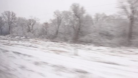 Movement winter landscape scene from railway coach window view