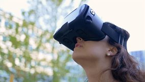 Woman Using VR Goggles Outside Closeup