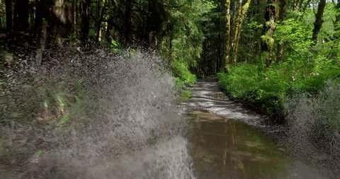 POV Driving Off Road Puddle Jumping Big Sprays Potholes on Gravel Forest Road