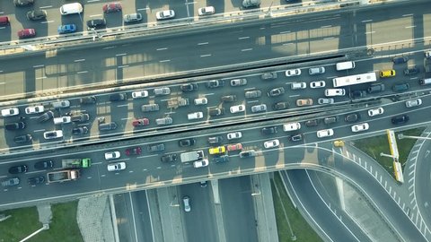 Aerial top down shot of a traffic jam on a car road intersection in the rush hour. 4K video