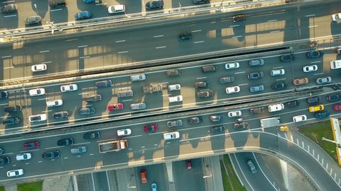 Aerial top down descending shot of a traffic jam on a city highway in the rush hour. 4K video