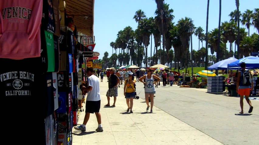 VENICE BEACH, CA - AUGUST 2: Tourists walking on the Venice Beach Boardwalk and