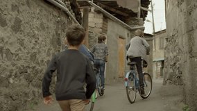 4K. Kids, Friends riding bikes, bicycles. Vintage times. Memories. Shot on RED EPIC DRAGON Cinema Camera in slow motion.