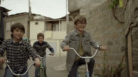 4K. Kids, Friends riding bikes, bicycles. Vintage times. Memories. Shot on RED EPIC DRAGON Cinema Camera in slow motion.