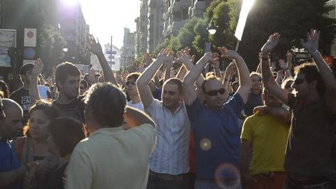 LEON, SPAIN - CIRCA 2011: People take a part in a demonstration in solidarity action for the worldwide protest dubbed "Occupy the City" in Leon, Spain on October 15, 2011.