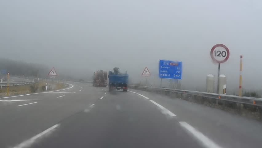LEON, SPAIN - CIRCA 2011: Driving in bad weather conditions (heavy rain, strong