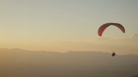 Paragliding into the sunset in Brazil