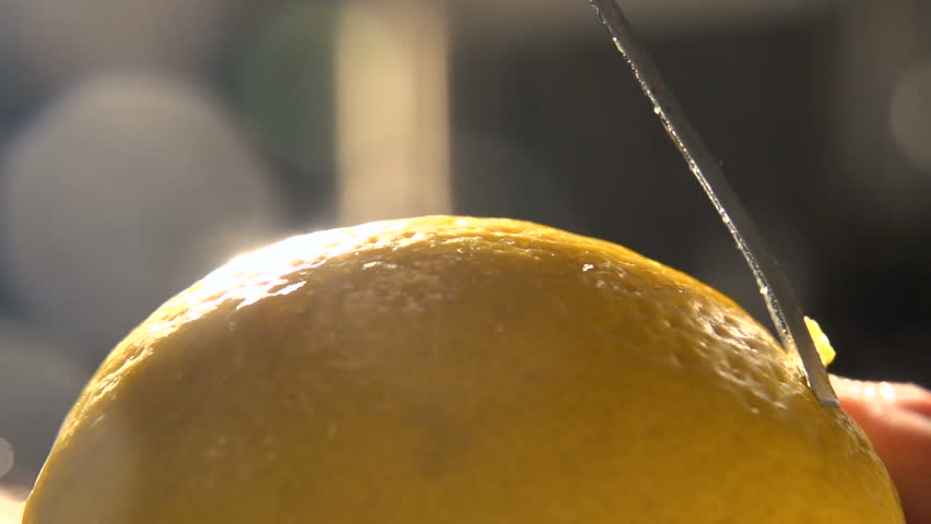 citrus zester on lemon skin. Peeling lemon skin. Juicy delicious lemon peeled from the peel. citrus zest being grated. lemon peel on grater in kitchen. nutrition and wellness. Health food. Slow motion Royalty-Free Stock Footage #27611005