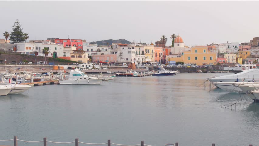 Ischia April 2017 Italy: View of the small tourist harbor in Forio in the sunset of a cloudy day in April, Forio is one of the tourist destinations of Ischia Island in the Gulf of Naples, Italy