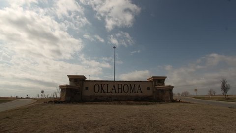 A time-lapse of an Oklahoma sign off I-35 with fast moving clouds Stockvideó