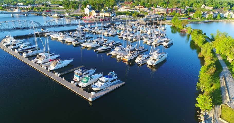 Sturgeon Bay Wisconsin Canal Waterfront with sailboats, bridge and tugboats, aerial view.