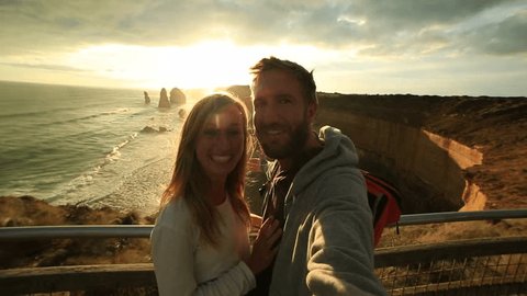 Twelve Apostles selfie
Young couple take a selfie portrait at sunset by the Twelve Apostles sea rocks on the Great Ocean Road in Victoria's state of Australia.
