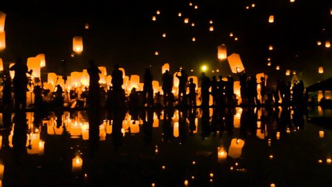 Many Sky Fire Lanterns Floating Up To The Sky In Yee Peng Lanna International 2016 And Reflection on Water Landmark Destination Travel Of Chiang Mai, Thailand