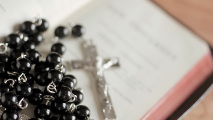 Bible and Rosary come into focus