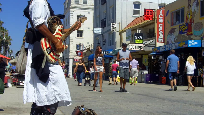 VENICE BEACH, CA - August 2, 2012:  A street musician on the Venice Beach