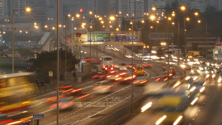 Time lapse of Hong Kong city rush-hour traffic at dusk.