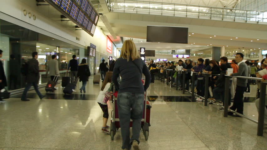 HONG KONG - DECEMBER 21: Slow motion of People in the arrivals hall at Hong Kong