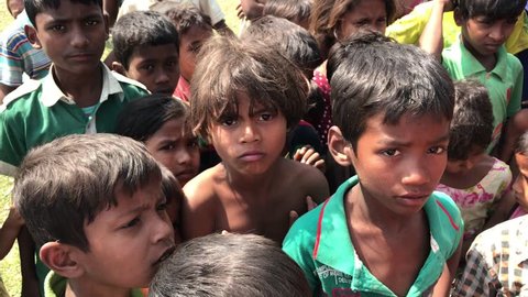 TEKNAF, BANGLADESH - APRIL 1, 2017 : Rohingya refugees from Myanmar waiting for food aid in Kutupalong refugee camp near Cox's Bazar, Bangladesh.