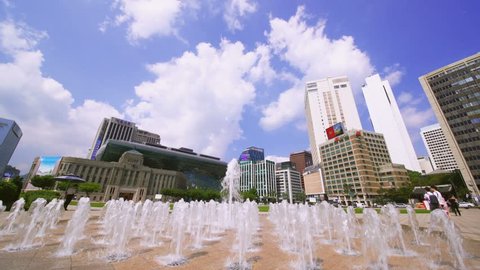 Tilt down of Fountains in front Seoul City Hall in Seoul Plaza,Korea. The building was constructed by the Japanese occupation government in 1926.