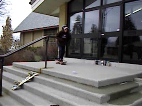 skateboarder crashing into wall after bail on stair set