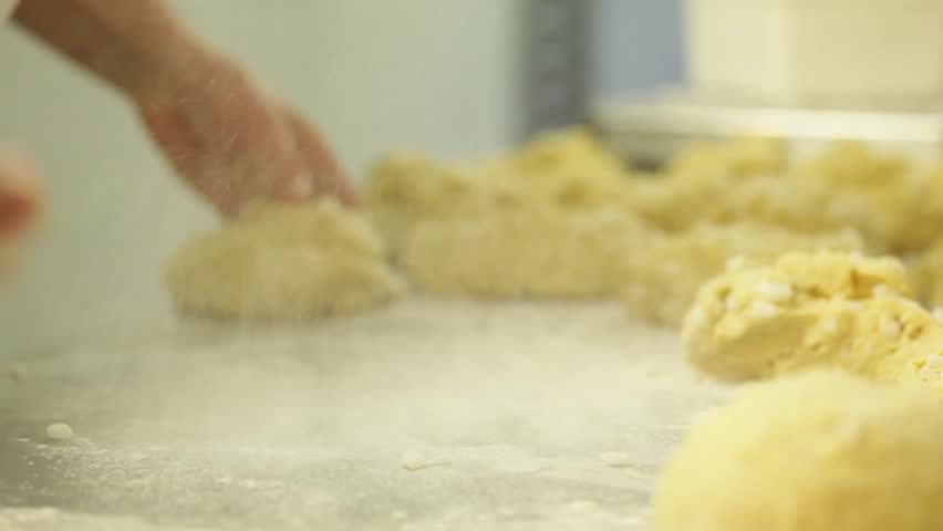 Kneading dough into balls