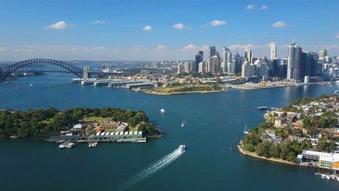 4k aerial video of Sydney Harbour, with view of Harbour Bridge, Opera House and skyline of CBD