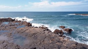 Drone flight in 4k uhd video over rocky environment on the atlantic ocean coast somewhere on gran canaria, canary islands, spain.
