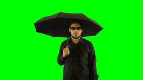 4K Man with a Black Shirt and Umbrella Waiting Under Rain for Funeral Green Screen Chroma Key Background Sunglasses Fully Black - Powered by Shutterstock - Get 15% off with code: PIKWIZARD15